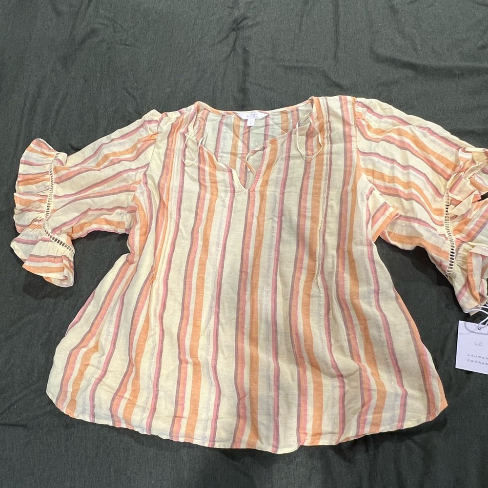 Brand new with tags. Multi color (mainly pastel yellow) Lauren Conrad blouse.